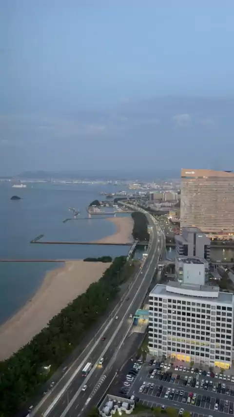 View from Fukuoka Tower at dusk over Momochi beach, the expressway and the Hilton Sea Hawk